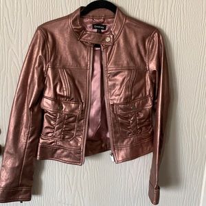 Pink metallic jacket. Wear and tear. It’s been in the closet for over 15 year.